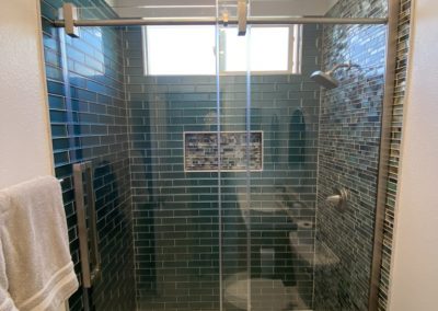 Bathroom remodel with new shower, tile, quartz countertop and a linear shower drain