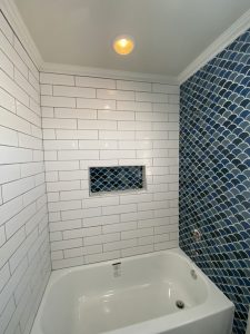 Bathrood remodel with bathtub and accent wall