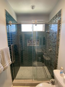 Bathroom remodel with new shower, tile, quartz countertop and a linear shower drain